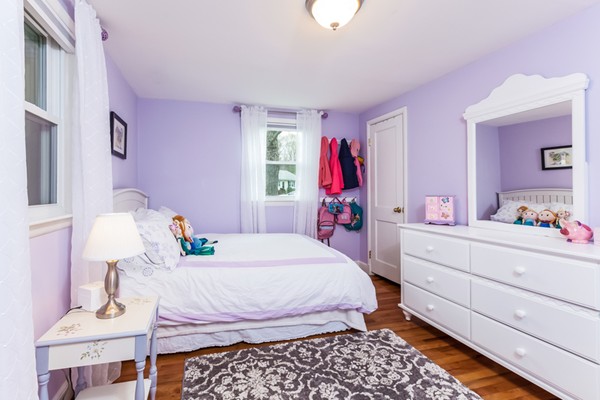 18 Mountain Road Waltham, MA 02451 - Photo 15 of 22 a bed room with a bed and a table