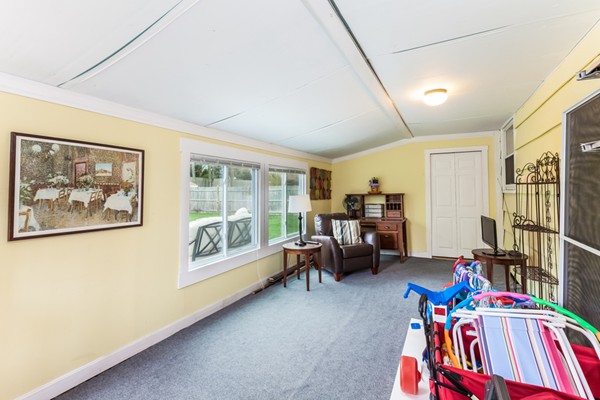 18 Mountain Road Waltham, MA 02451 - Photo 17 of 22 a bed room with furniture and a book shelf