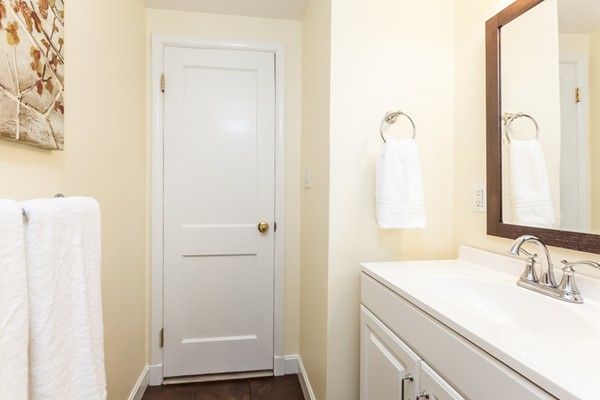 18 Mountain Road Waltham, MA 02451 - Photo 19 of 22 a bathroom with a sink and a mirror