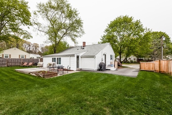 18 Mountain Road Waltham, MA 02451 - Photo 22 of 22 a front view of a house with patio and garden