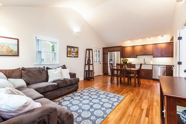 18 Mountain Road Waltham, MA 02451 - Photo 9 of 22 a living room with furniture and kitchen view with wooden floor