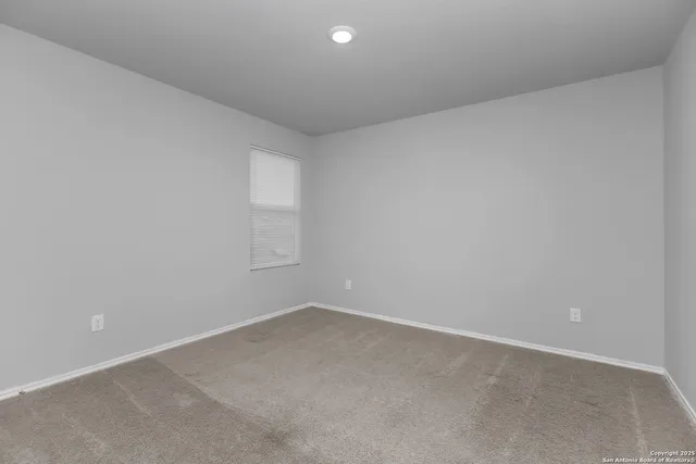 an empty room with a empty space and window
