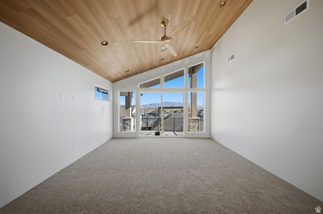 3011 East Rimrunner Drive, Unit 302 St. George, UT 84790 - Photo 27 of 45 Empty room featuring a ceiling fan, carpet floors, a vaulted wood ceiling, and a mountain view