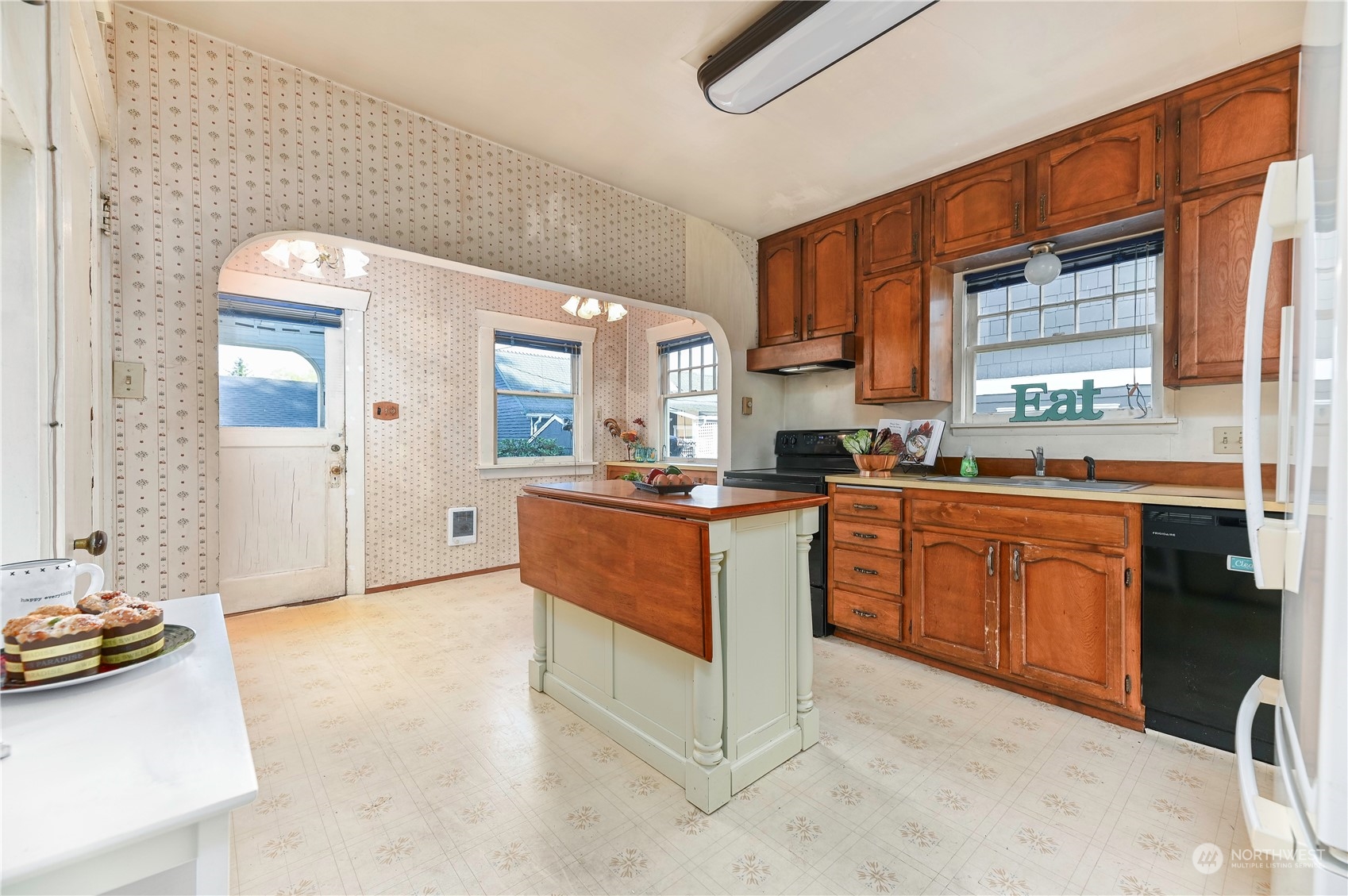 1419 Rucker Avenue Everett, WA 98201 - Photo 13 of 39 a kitchen with stainless steel appliances granite countertop a stove a sink and a refrigerator