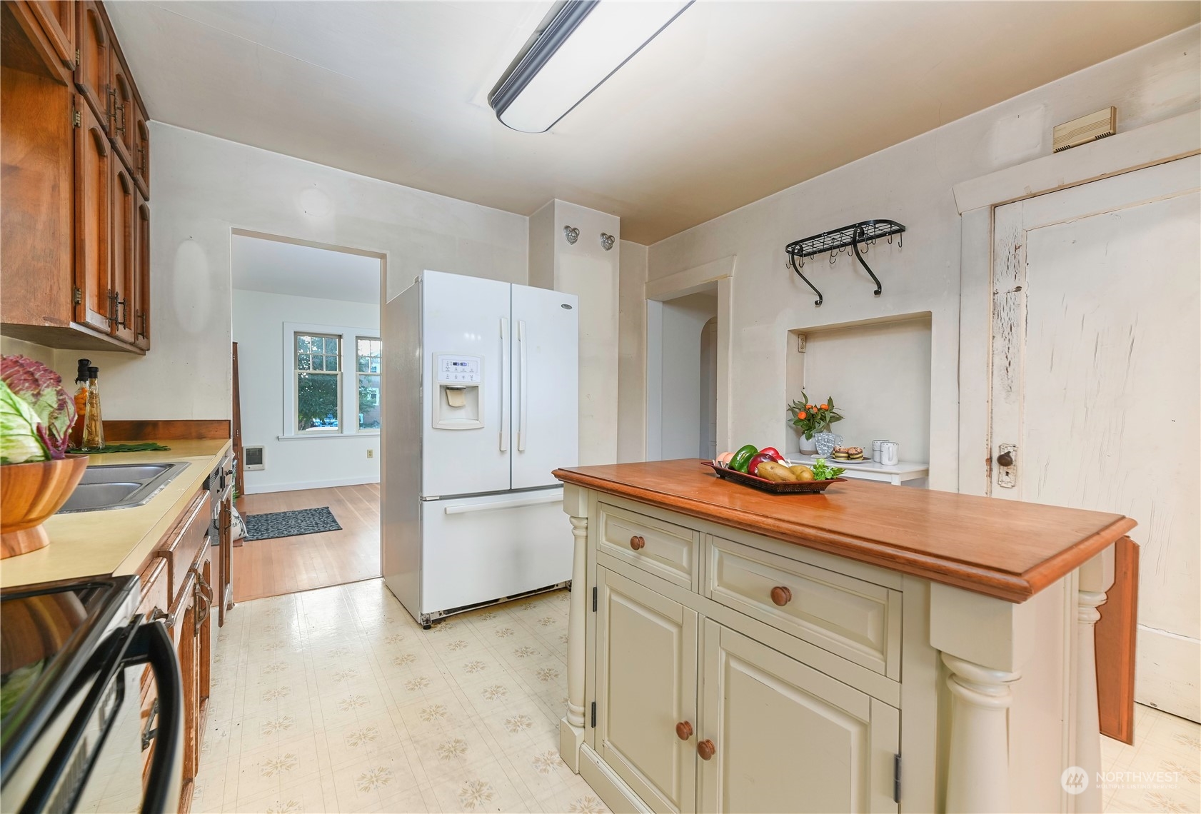 1419 Rucker Avenue Everett, WA 98201 - Photo 15 of 39 a kitchen with refrigerator and cabinets
