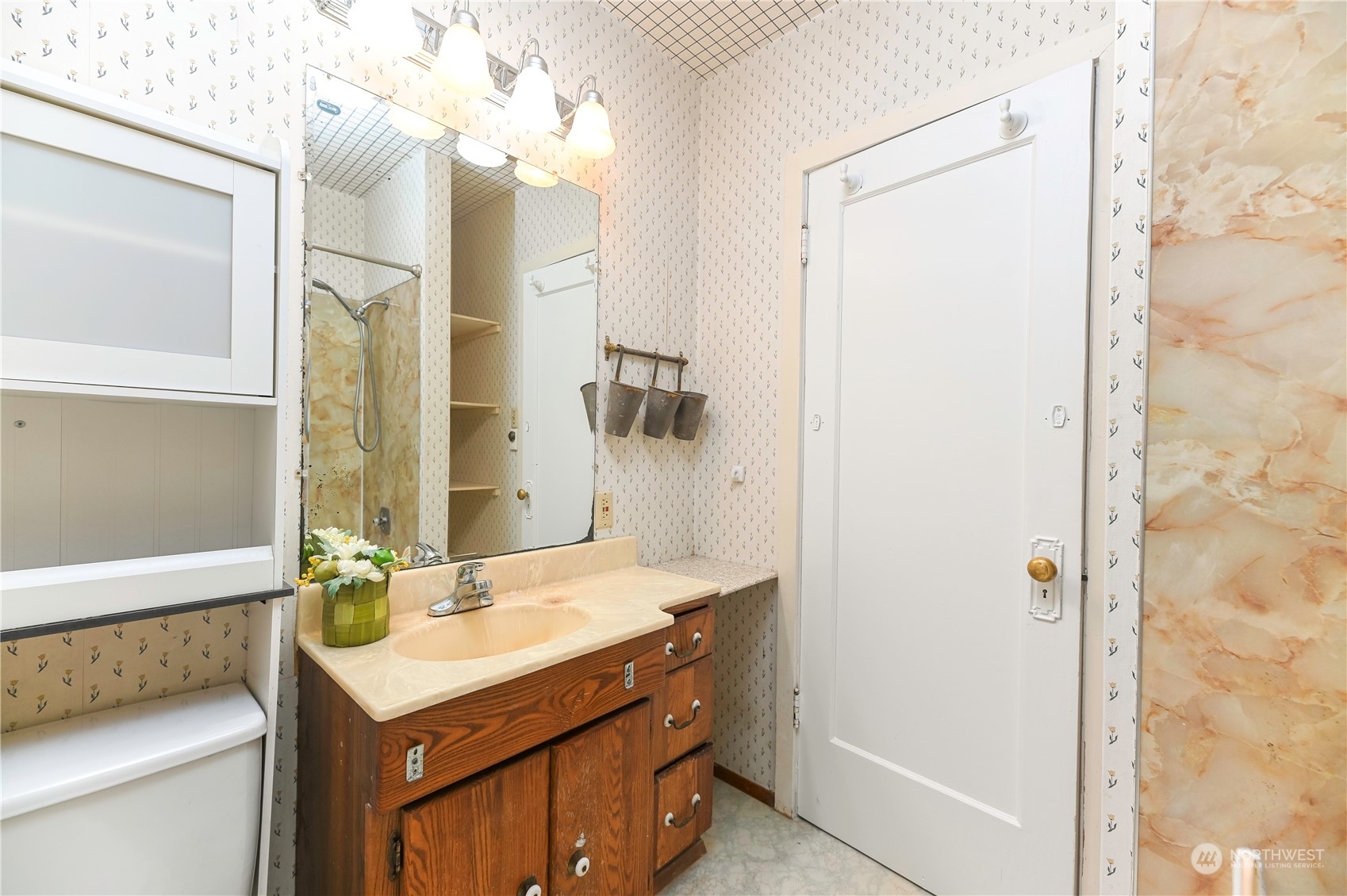 1419 Rucker Avenue Everett, WA 98201 - Photo 17 of 39 a bathroom with a sink a toilet and shower