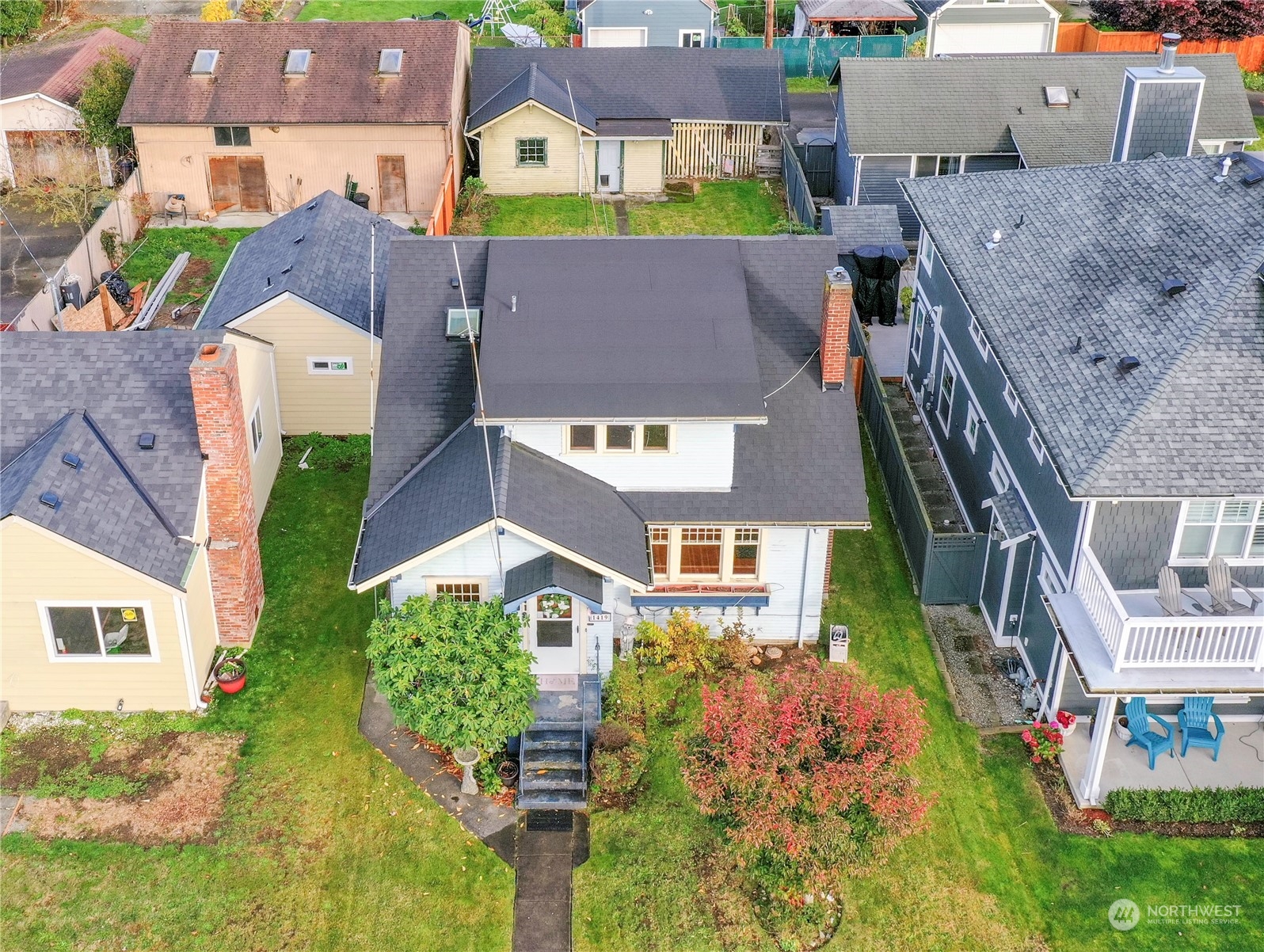 1419 Rucker Avenue Everett, WA 98201 - Photo 2 of 39 an aerial view of a house with a garden and trees