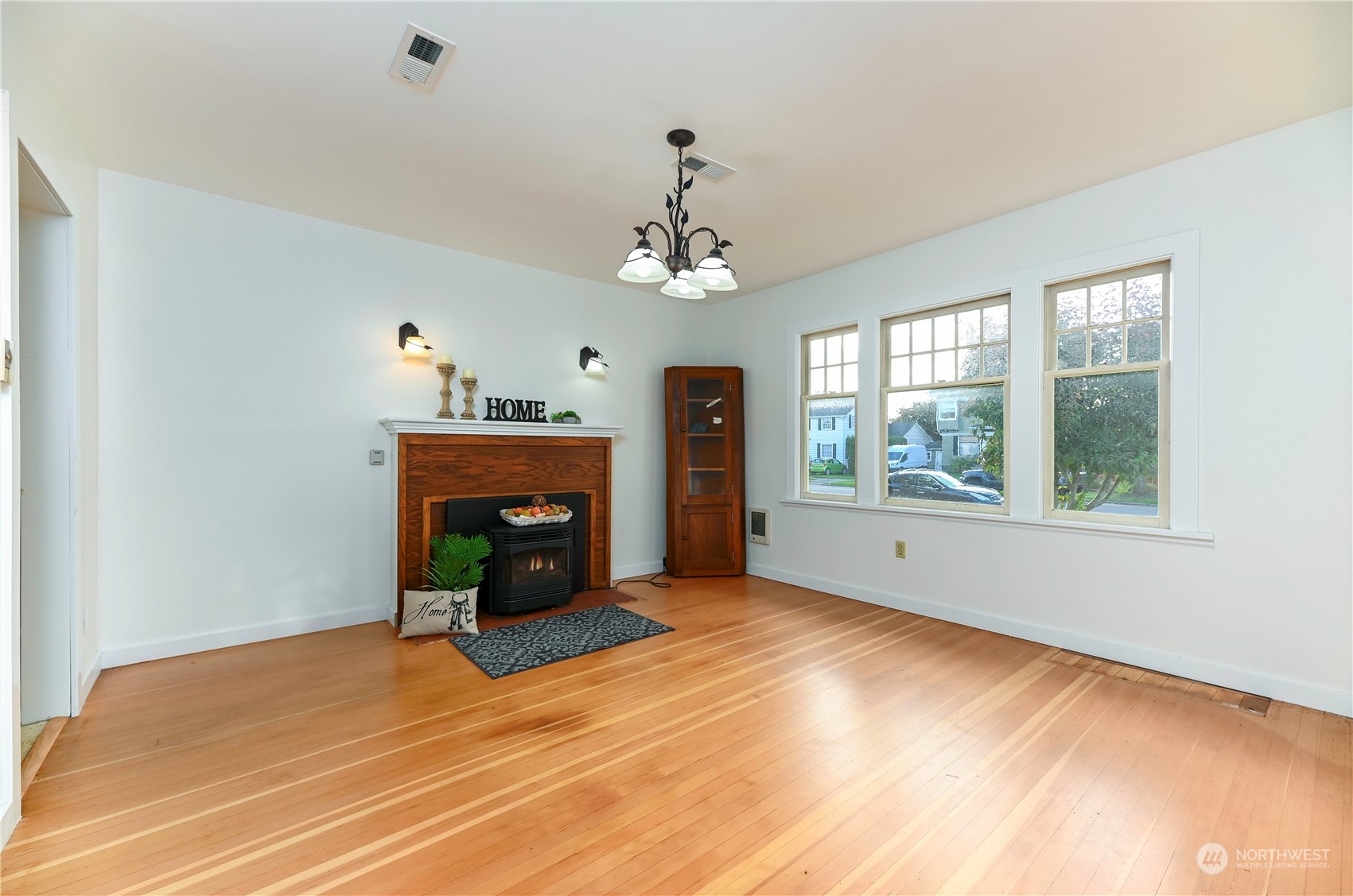 1419 Rucker Avenue Everett, WA 98201 - Photo 8 of 39 a view of an empty room with a window and fireplace