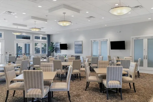 a view of a swimming pool with a table and chairs