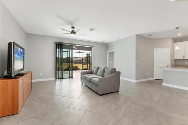 a kitchen with stainless steel appliances granite countertop a refrigerator a stove a sink and a microwave