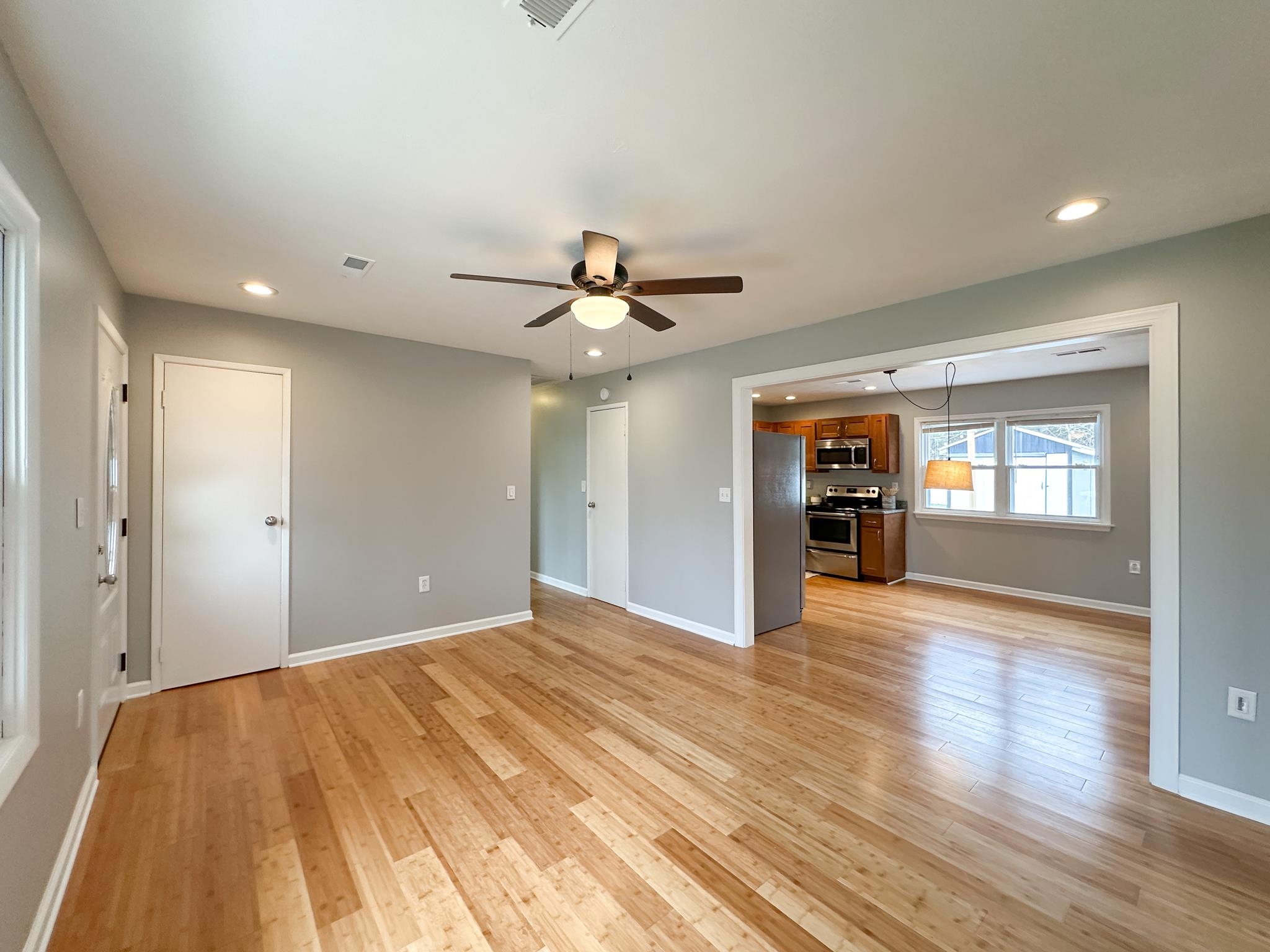 7472 Lilly Square Dayton, VA 22821 - Photo 11 of 30 a view of an empty room with wooden floor and a window