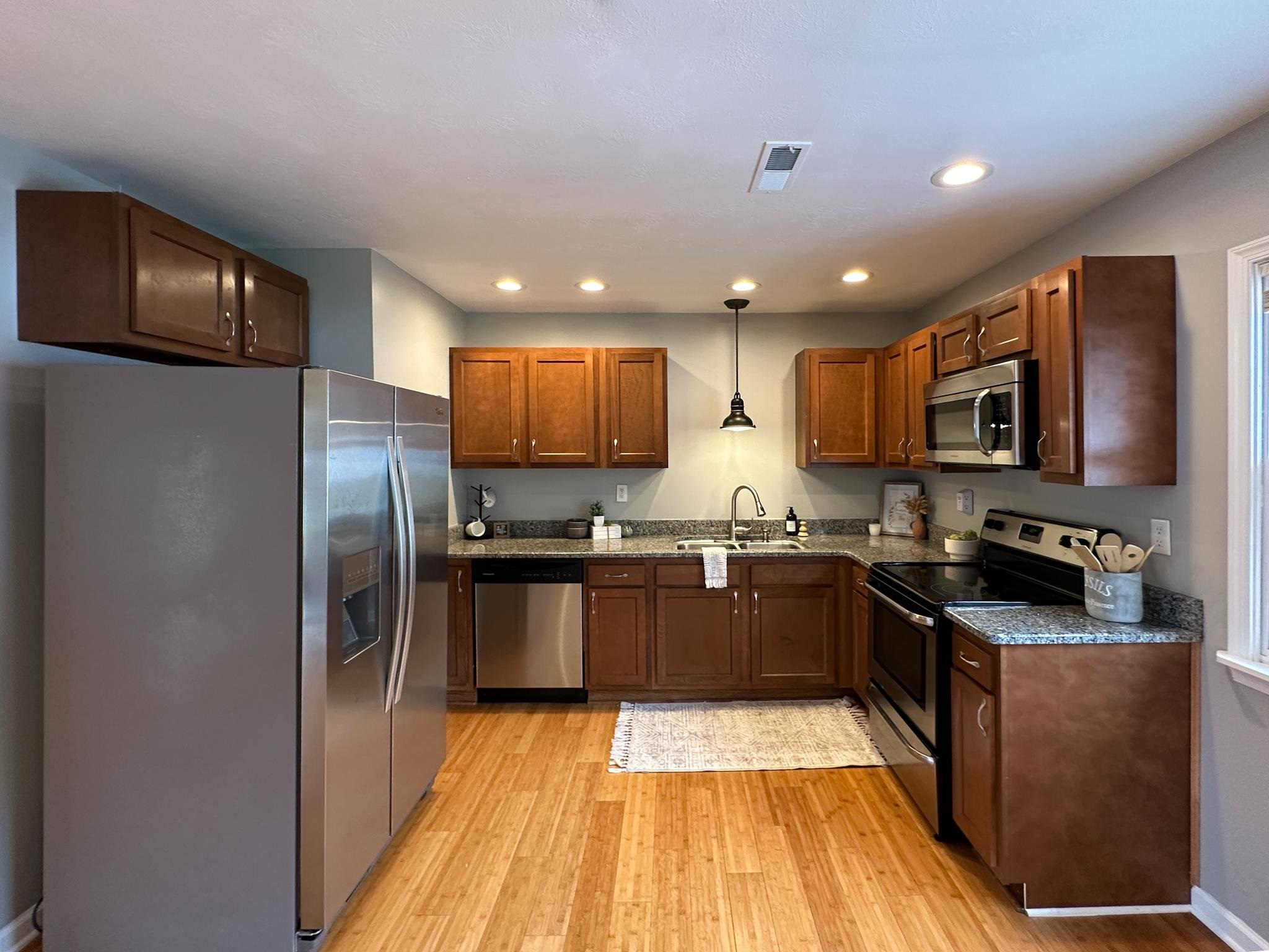 7472 Lilly Square Dayton, VA 22821 - Photo 13 of 30 a kitchen with granite countertop stainless steel appliances and wooden cabinets
