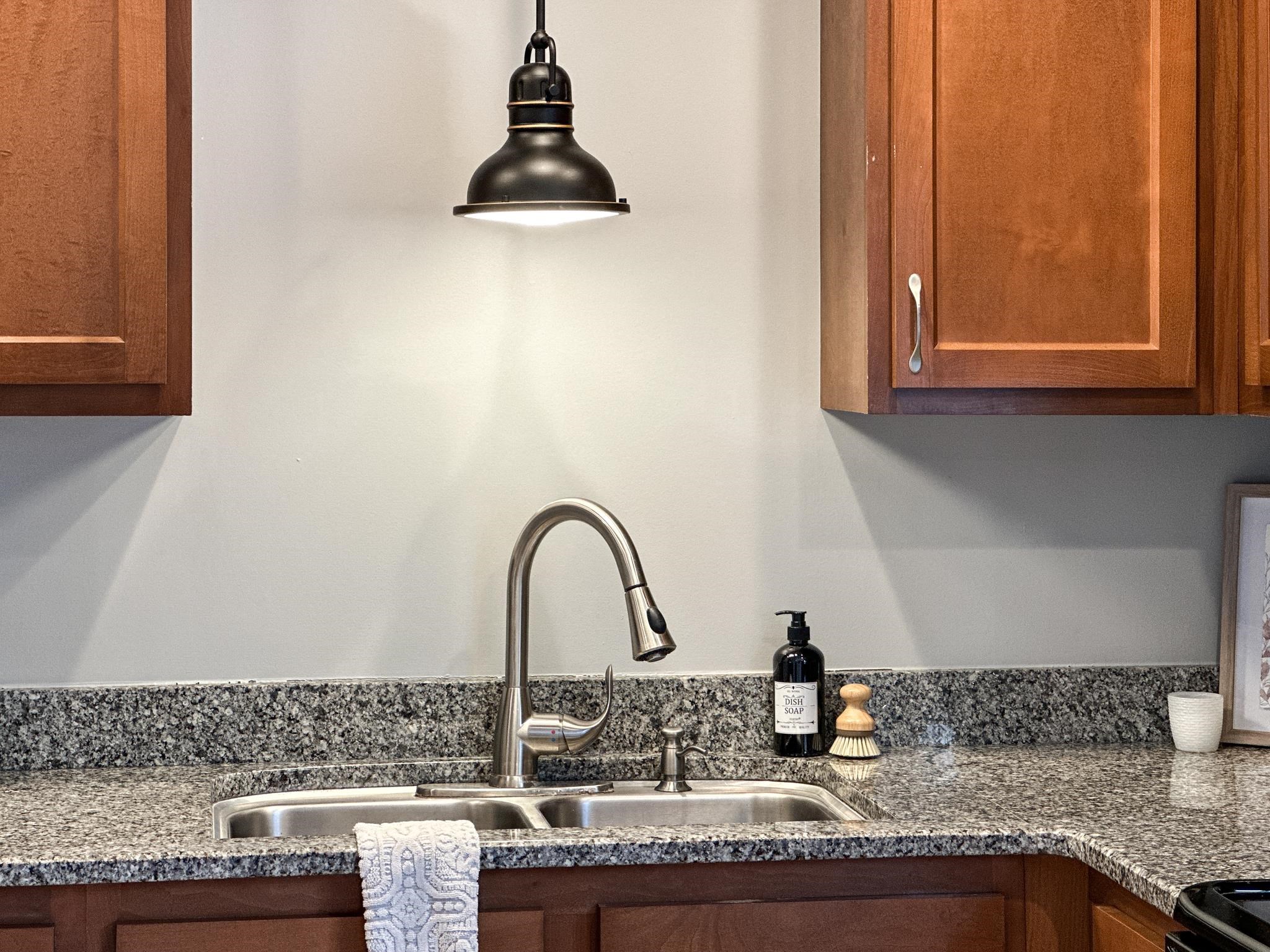 7472 Lilly Square Dayton, VA 22821 - Photo 14 of 30 a kitchen with granite countertop a sink and a stove