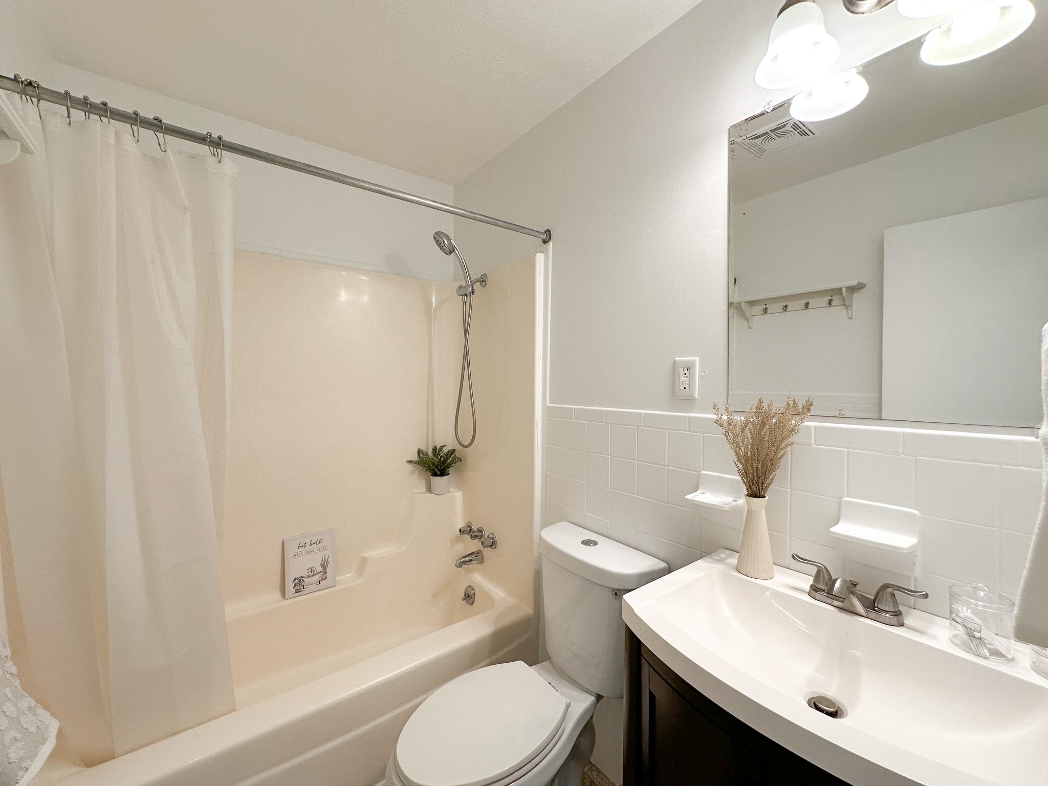 7472 Lilly Square Dayton, VA 22821 - Photo 23 of 30 a bathroom with a sink toilet and shower