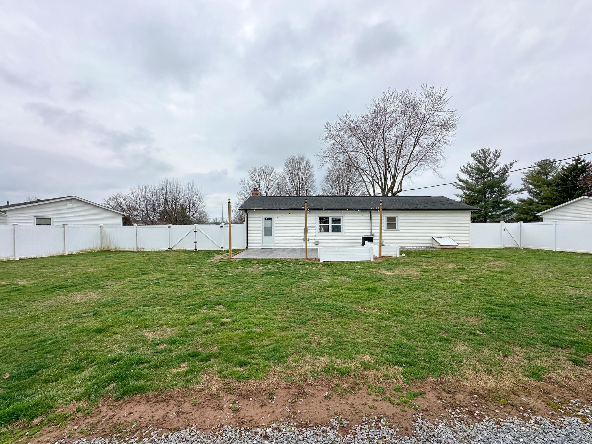 7472 Lilly Square Dayton, VA 22821 - Photo 27 of 30 a view of a big house with a big yard plants and large trees