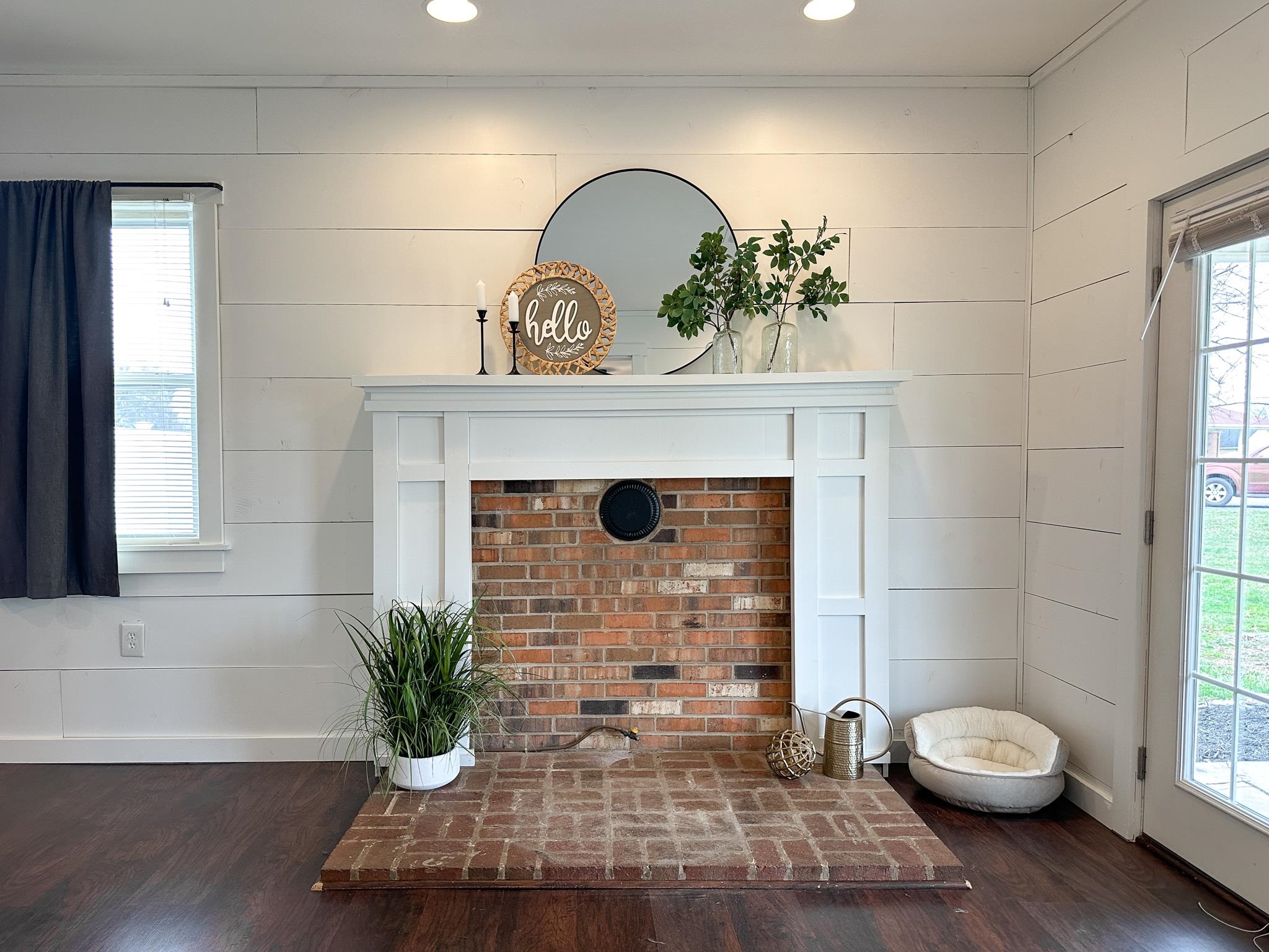 7472 Lilly Square Dayton, VA 22821 - Photo 6 of 30 a view of a livingroom with potted plants and a fireplace