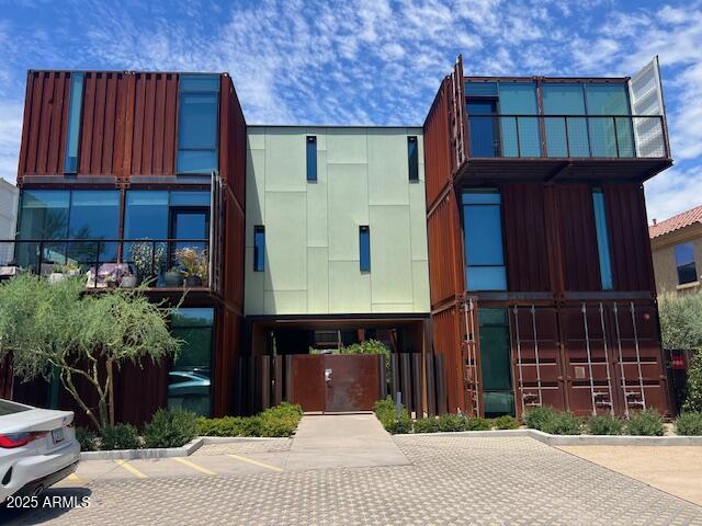 1436 South Terrace Road, Unit 102 Tempe, AZ 85281 - Photo 1 of 25 a front view of a house with a garden