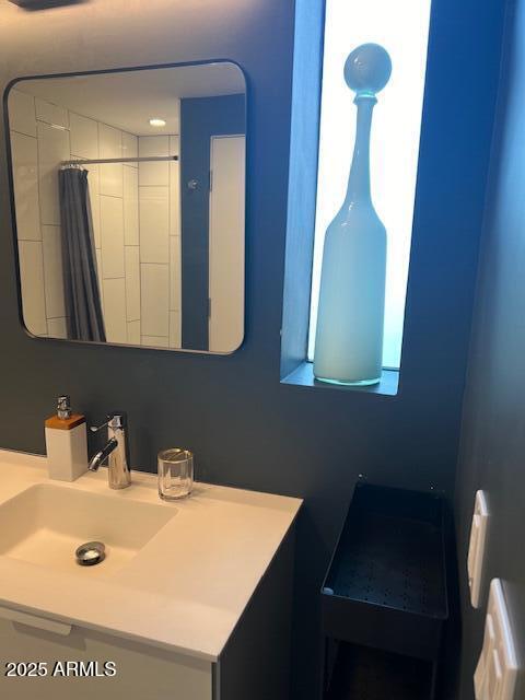 1436 South Terrace Road, Unit 102 Tempe, AZ 85281 - Photo 12 of 25 a bathroom with a sink and a mirror