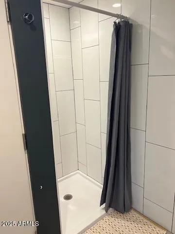 a bathroom with a shower and a tub