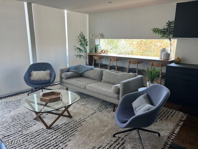 1436 South Terrace Road, Unit 102 Tempe, AZ 85281 - Photo 16 of 25 a living room with furniture and a large window