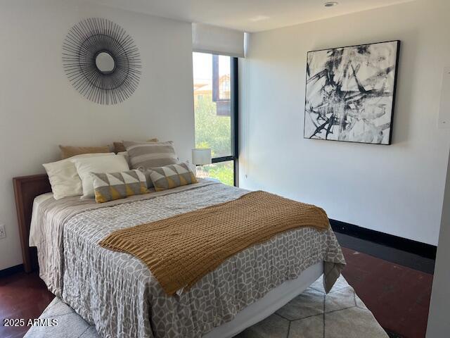 1436 South Terrace Road, Unit 102 Tempe, AZ 85281 - Photo 22 of 25 a bedroom with a large bed and a window