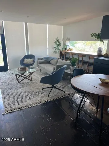a view of a dining room with furniture window and outside view