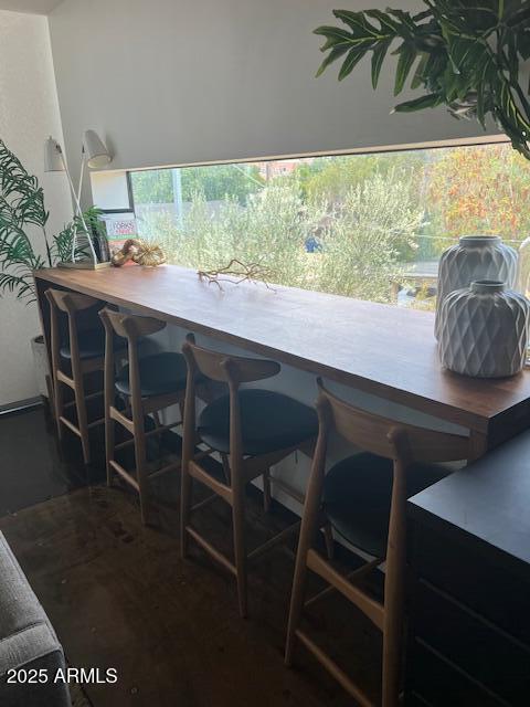 1436 South Terrace Road, Unit 102 Tempe, AZ 85281 - Photo 7 of 25 a dining room with furniture window and wooden floor