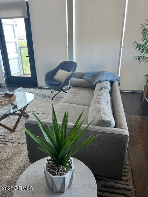 1436 South Terrace Road, Unit 102 Tempe, AZ 85281 - Photo 9 of 25 a view of a living room with furniture and a potted plant
