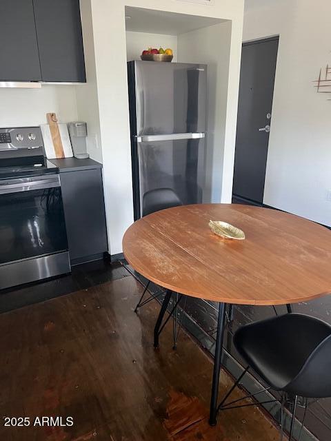 1436 South Terrace Road, Unit 102 Tempe, AZ 85281 - Photo 10 of 25 a view of a dining room with furniture and wooden floor