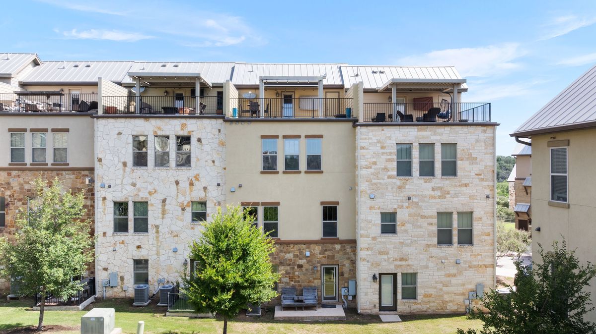 1116 Highknoll Lane Georgetown, TX 78628 - Photo 29 of 36 a large building with a lot of windows
