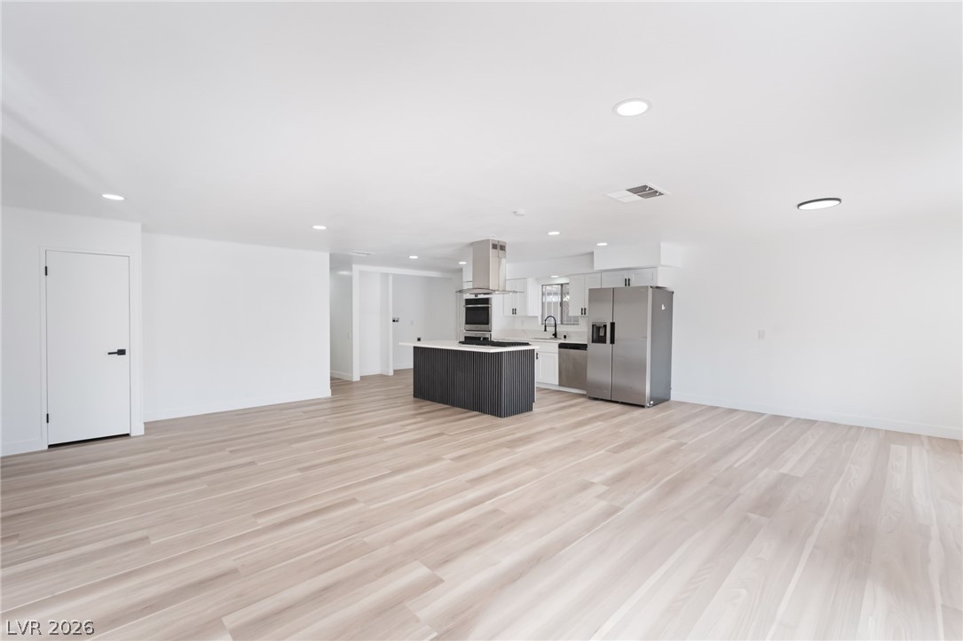 4980 Ridge Drive Las Vegas, NV 89103 - Photo 5 of 36 Unfurnished living room with light wood-type flooring and recessed lighting