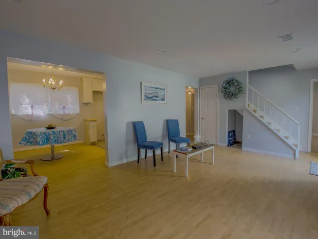 a view of a livingroom with furniture and a flat screen tv