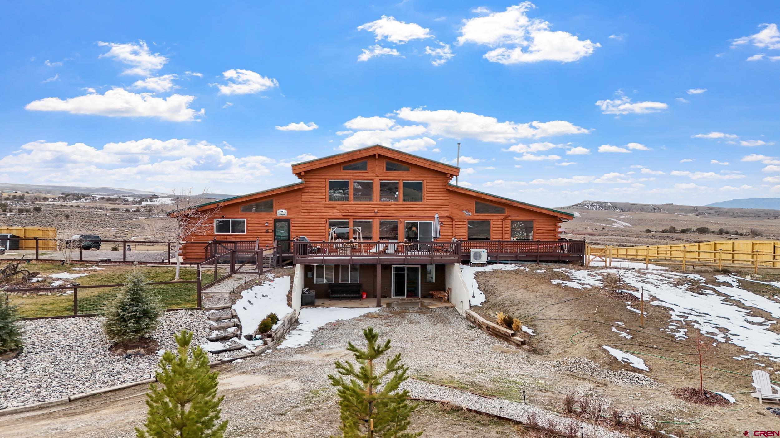 a view of a house with swimming pool patio and sitting area
