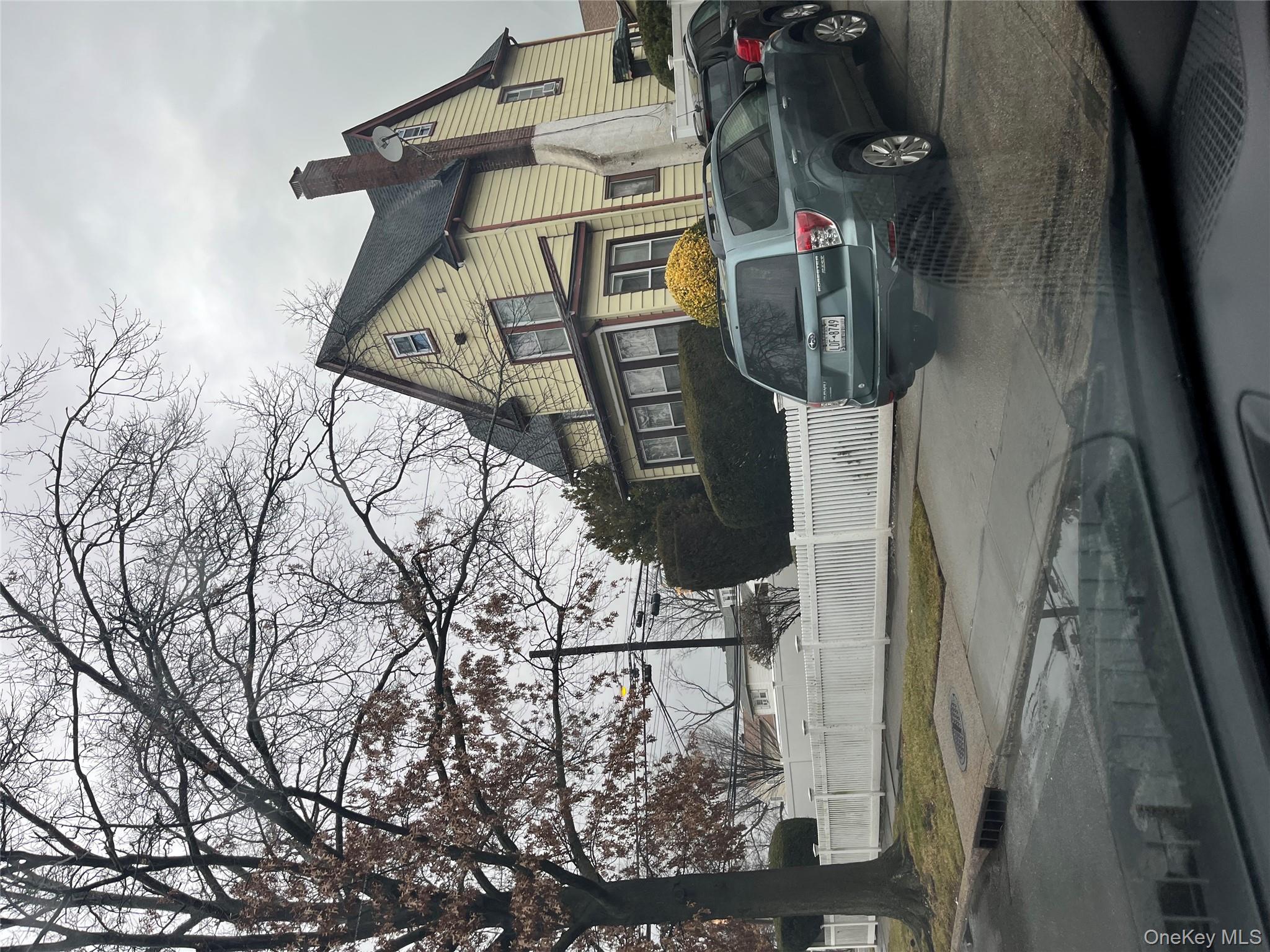 View of side of home with a chimney
