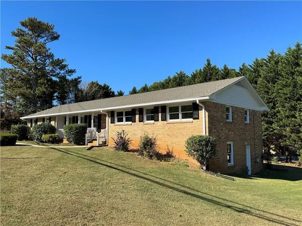 a front view of a house with a yard