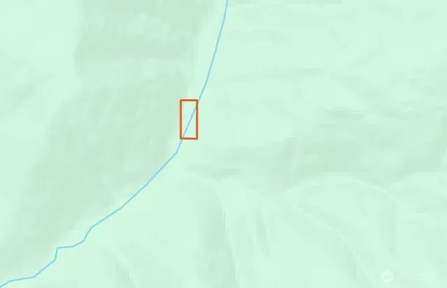 a aerial view of a residential apartment building with a yard