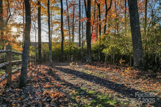 a view of stairs with wooden floor and fence
