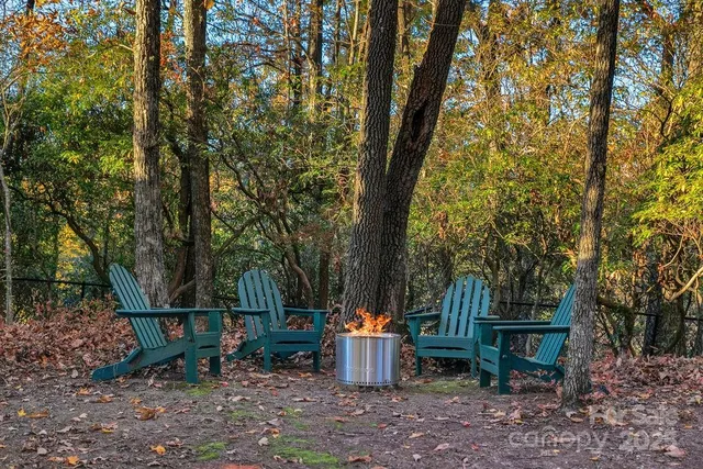 a kitchen with stainless steel appliances granite countertop a refrigerator stove and sink