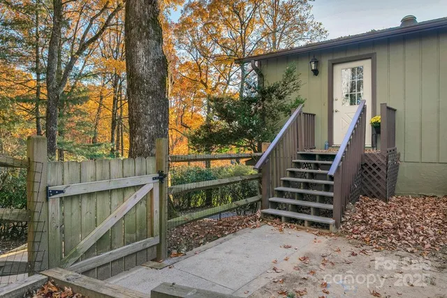 a view of a workspace with furniture and wooden floor