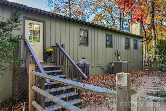 a view of a room with furniture and wooden floor
