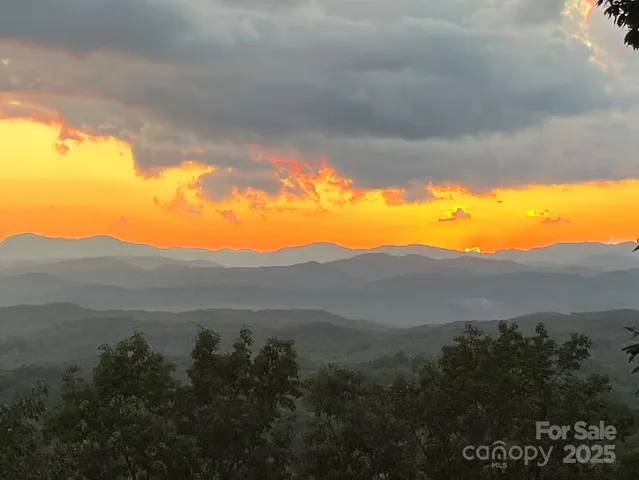 a view of balcony with wooden floor and outdoor seating