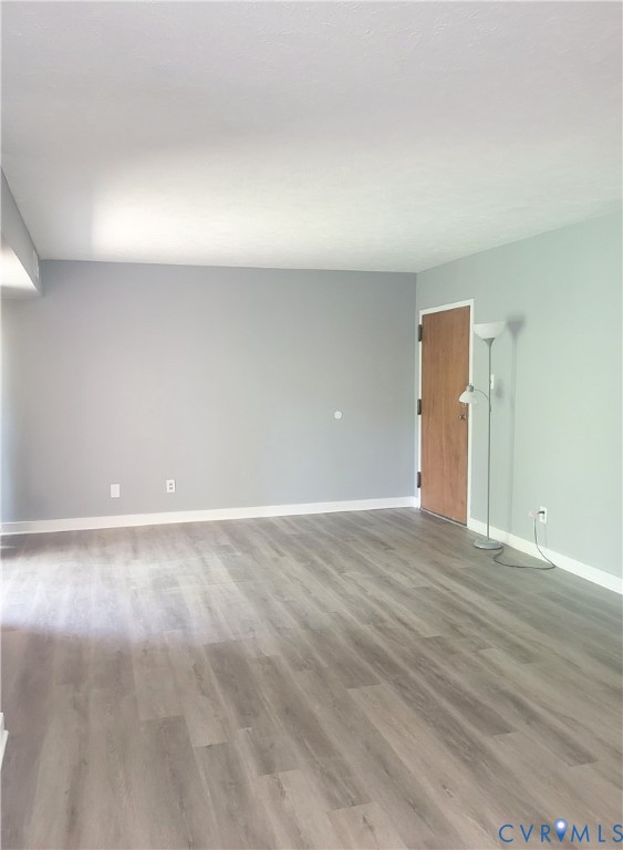 5204 Castlewood Road, Unit C Richmond, VA 23234 - Photo 2 of 12 a view of an empty room and wooden floor