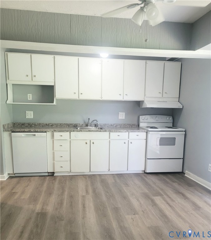 5204 Castlewood Road, Unit C Richmond, VA 23234 - Photo 4 of 12 a kitchen with granite countertop white cabinets and white appliances