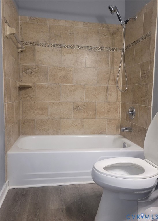 5204 Castlewood Road, Unit C Richmond, VA 23234 - Photo 7 of 12 a bathroom with a toilet and a bath tub