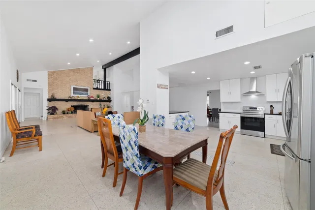 a view of a dining area kitchen with furniture and a wooden floor