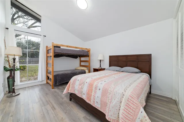 a bedroom with a bed and a mirror