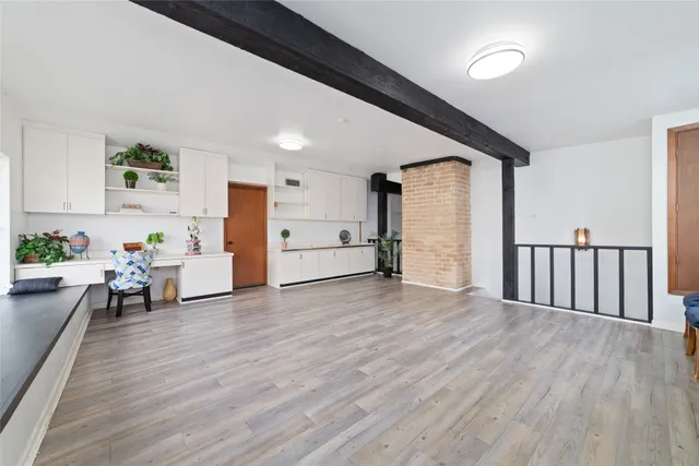 a view of kitchen with furniture and wooden floor