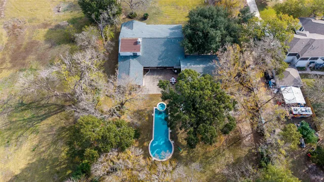 a backyard of a house with a yard and outdoor seating