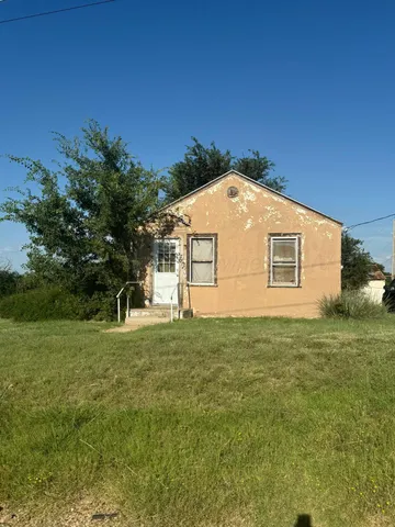a view of a backyard of the house