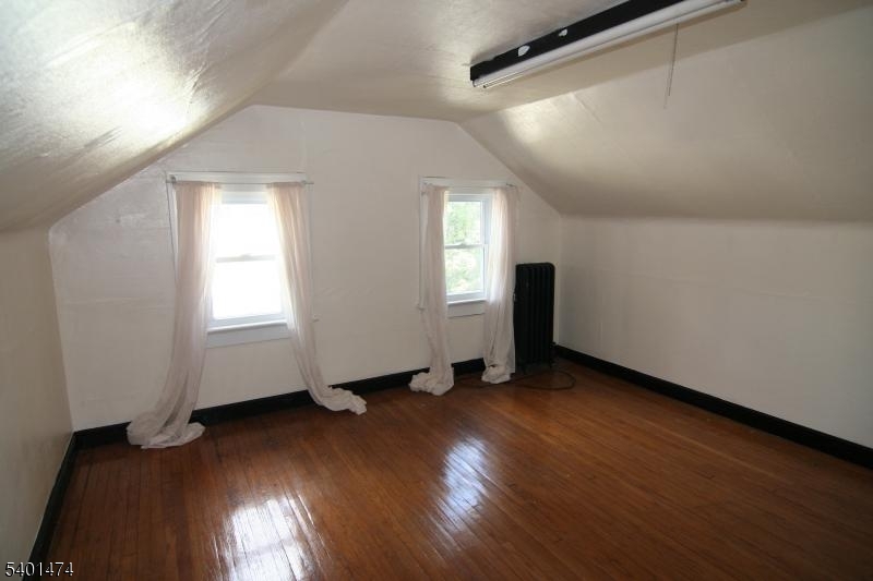 220 South Ridgewood Road South Orange, NJ 07079 - Photo 12 of 14 an empty room with wooden floor and windows